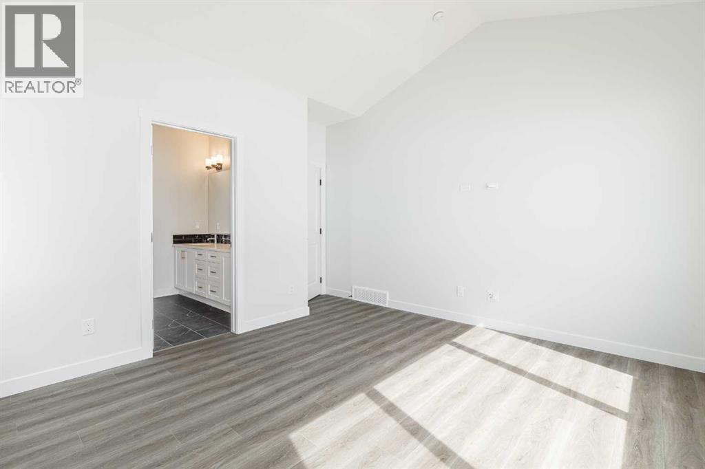 125 Monarch Bend NW, Rural Rocky View County, Alberta  T3Z 0K4 - Photo 13 - A2302248