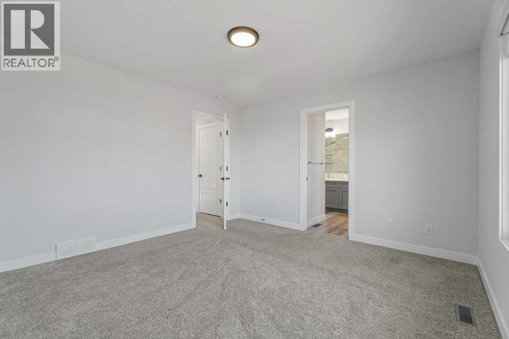 71 Ranchers View, Okotoks, Alberta  T1S 5R6 - Photo 24 - A2285159