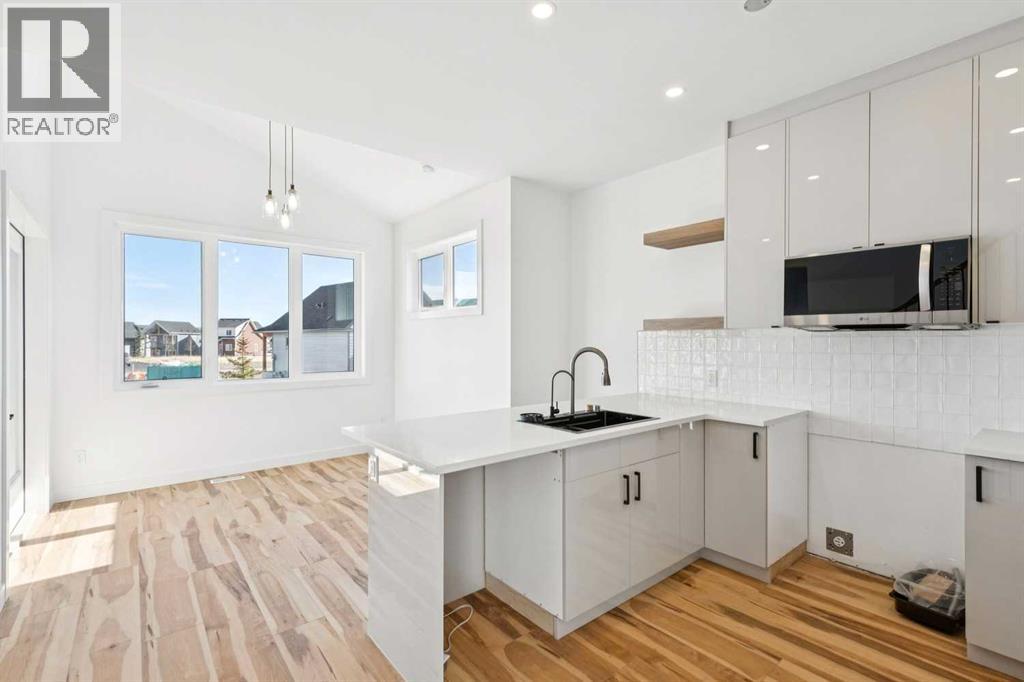 638 Cottageclub Bend, Rural Rocky View County, Alberta  T4C 1B1 - Photo 5 - A2303174