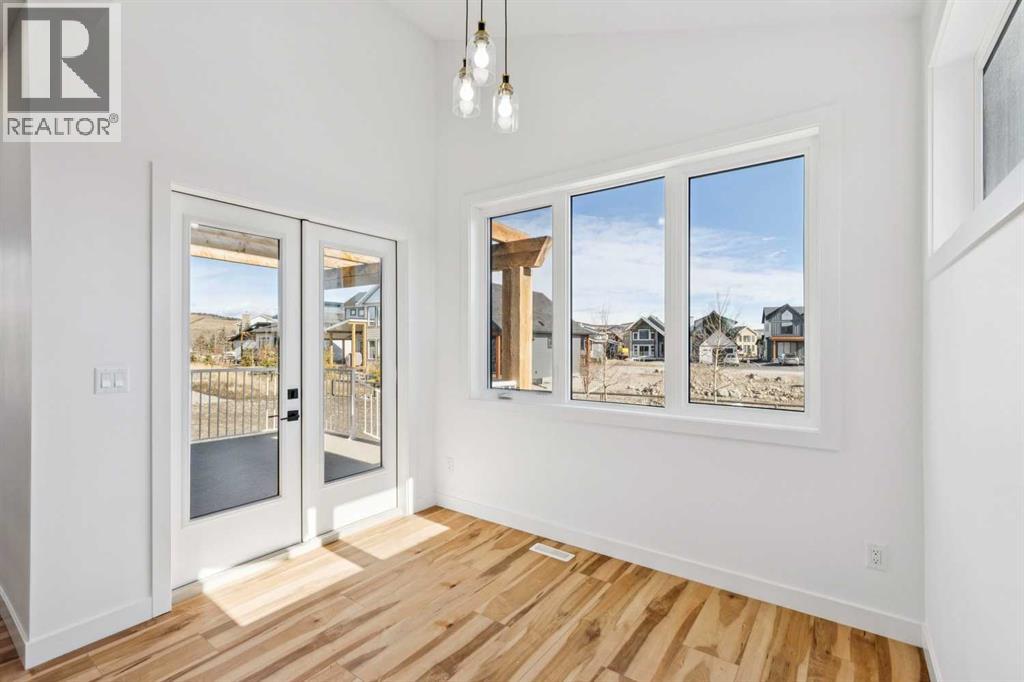 638 Cottageclub Bend, Rural Rocky View County, Alberta  T4C 1B1 - Photo 9 - A2303174