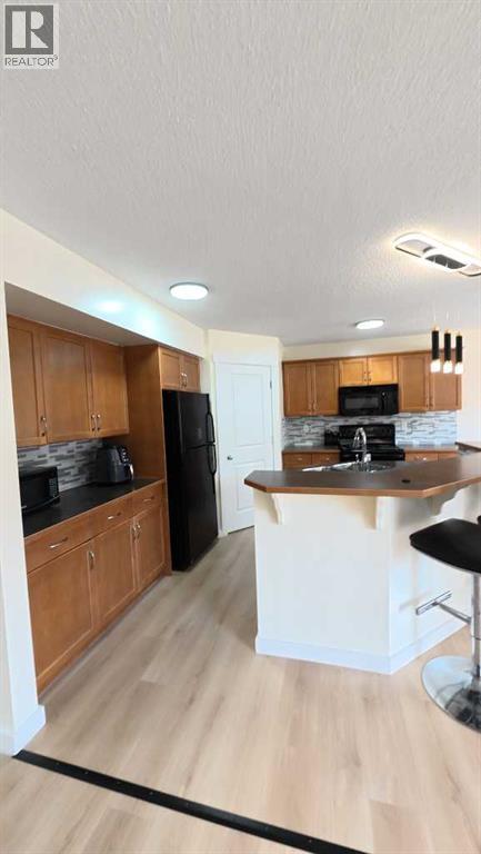 217 Coopers Grove SW, Airdrie, Alberta  T2B 0G4 - Photo 19 - A2303255