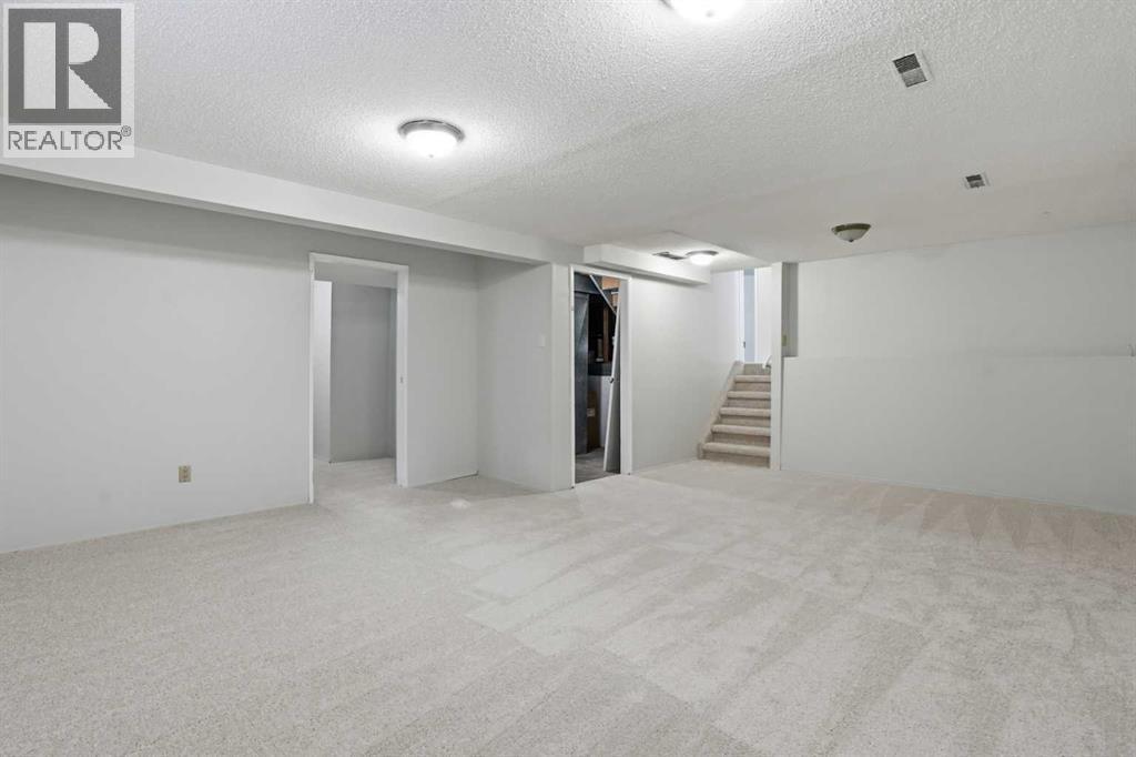 107 Nottingham Road, Calgary, Alberta  T3A 3P9 - Photo 26 - A2301234