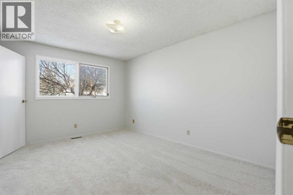 107 Nottingham Road, Calgary, Alberta  T3A 3P9 - Photo 12 - A2301234