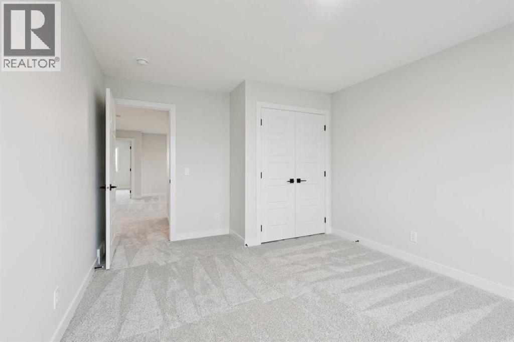 57 Southborough Square, Cochrane, Alberta  T4C 3J7 - Photo 32 - A2293227