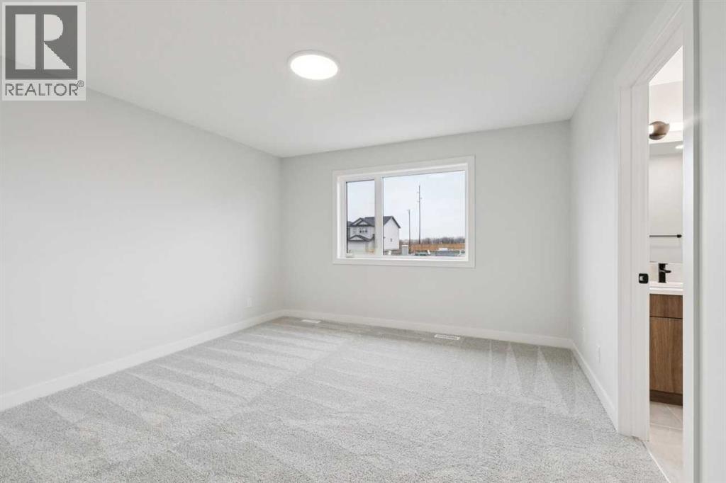 57 Southborough Square, Cochrane, Alberta  T4C 3J7 - Photo 24 - A2293227