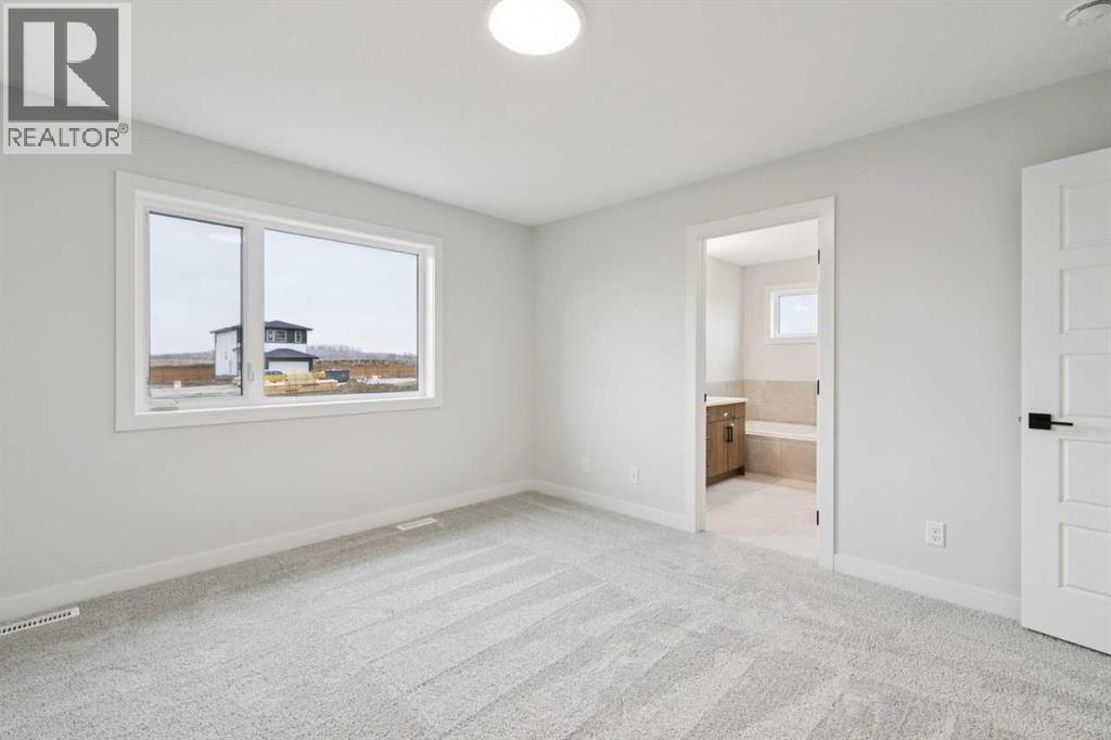 57 Southborough Square, Cochrane, Alberta  T4C 3J7 - Photo 27 - A2293227