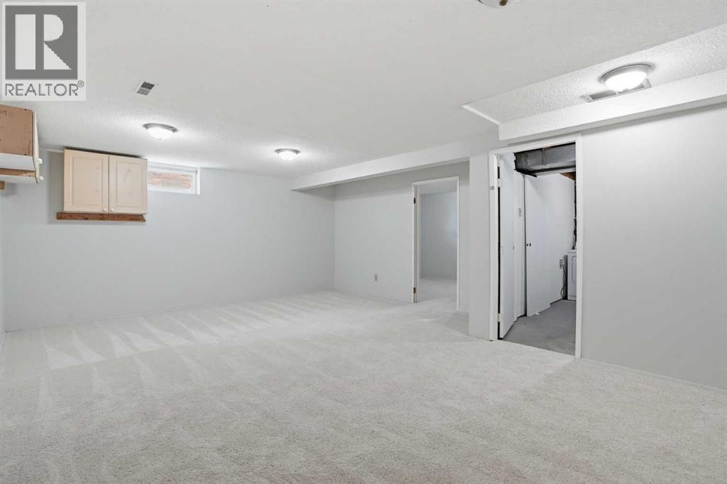 107 Nottingham Road, Calgary, Alberta  T2K 5R2 - Photo 37 - A2301234