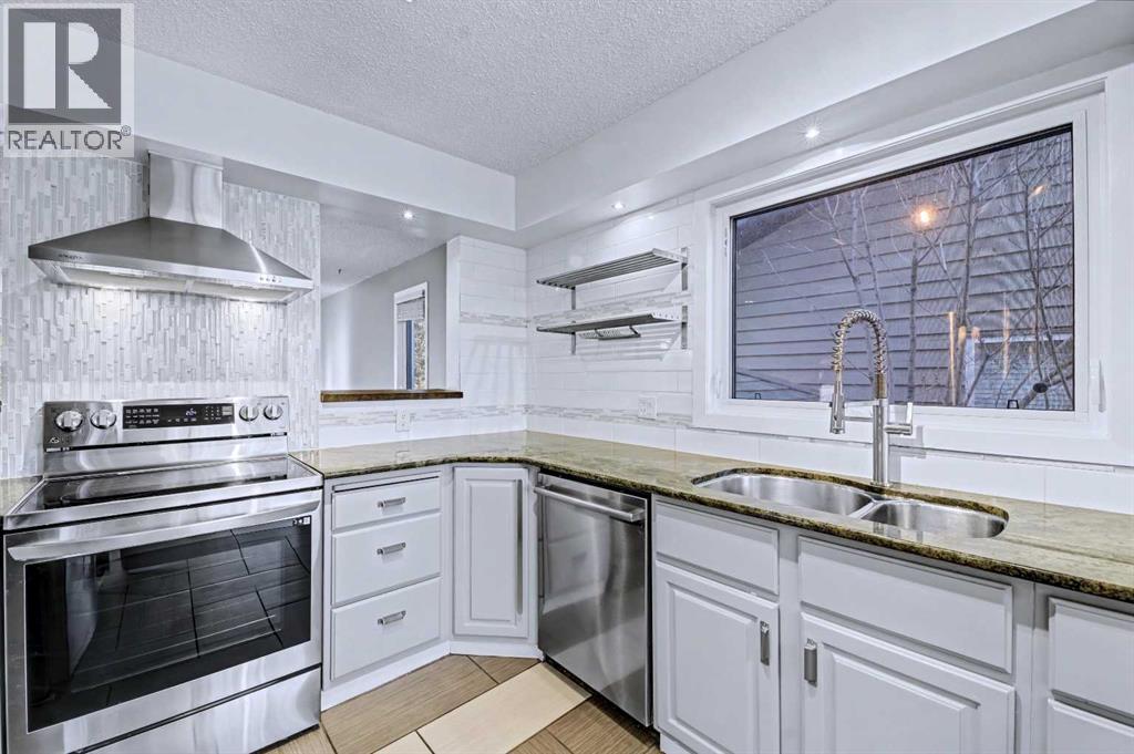 188 Bernard Drive NW, Calgary, Alberta  T3K 2B7 - Photo 5 - A2287043