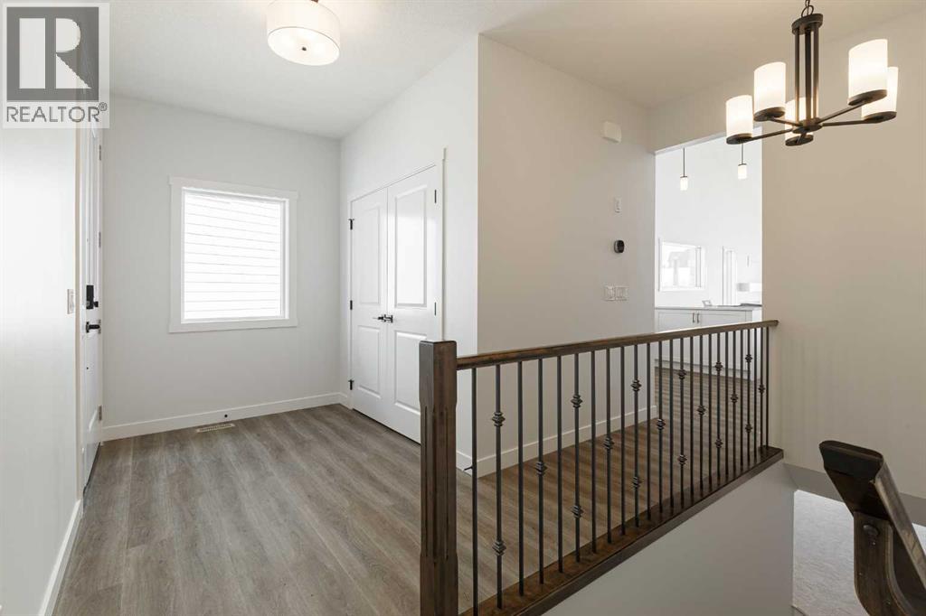 125 Monarch Bend, Rural Rocky View County, Alberta  T3Z 0K4 - Photo 4 - A2302248