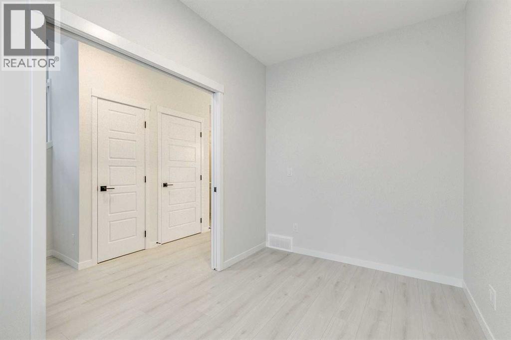 186 Creekside Manor SW, Calgary, Alberta  T2X 6J5 - Photo 5 - A2272147