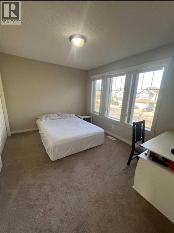217 Coopers Grove SW, Airdrie, Alberta  T2B 0G4 - Photo 24 - A2303255