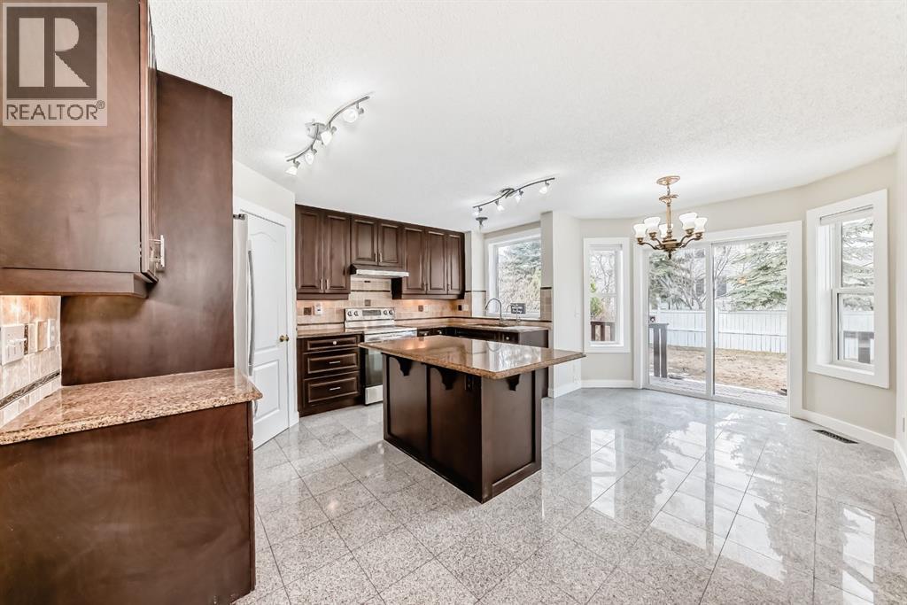 311 Rocky Ridge Cove Nw, Calgary, Alberta  T3G 4K1 - Photo 8 - A2300845