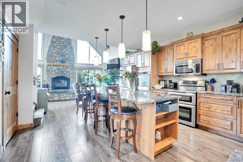 210 Cottageclub Crescent, Rural Rocky View County, Alberta  T4C 1B1 - Photo 5 - A2291756