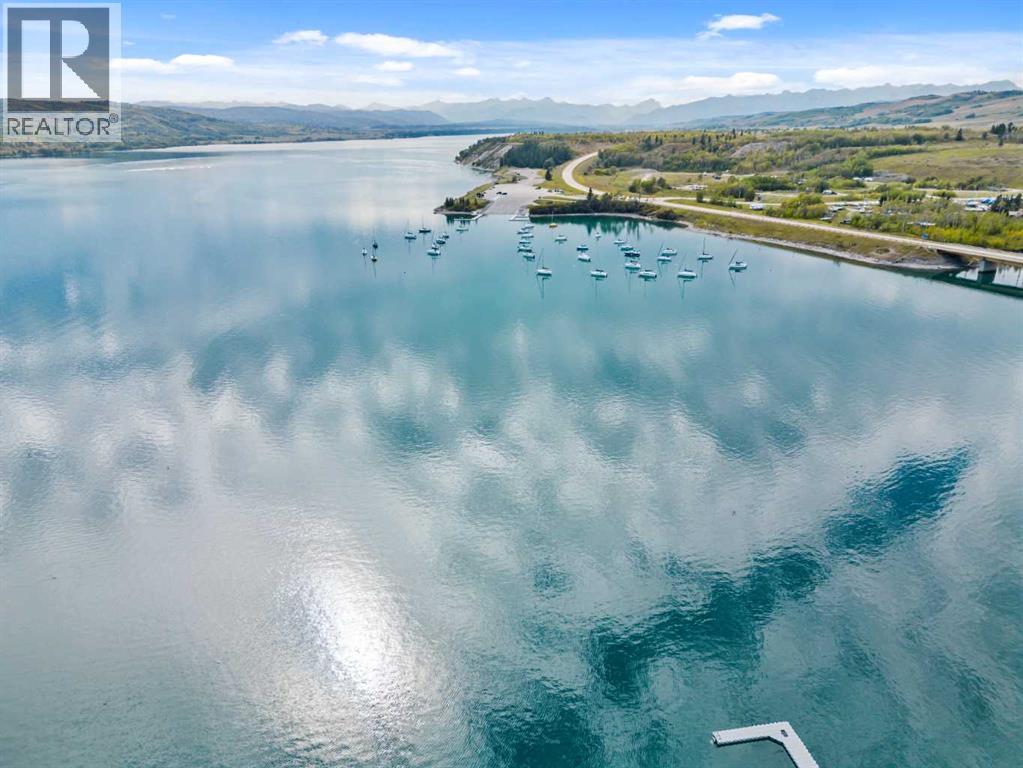 210 Cottageclub Crescent, Rural Rocky View County, Alberta  T4C 1B1 - Photo 32 - A2291756