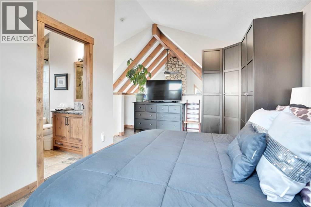 210 Cottageclub Crescent, Rural Rocky View County, Alberta  T4C 1B1 - Photo 16 - A2291756