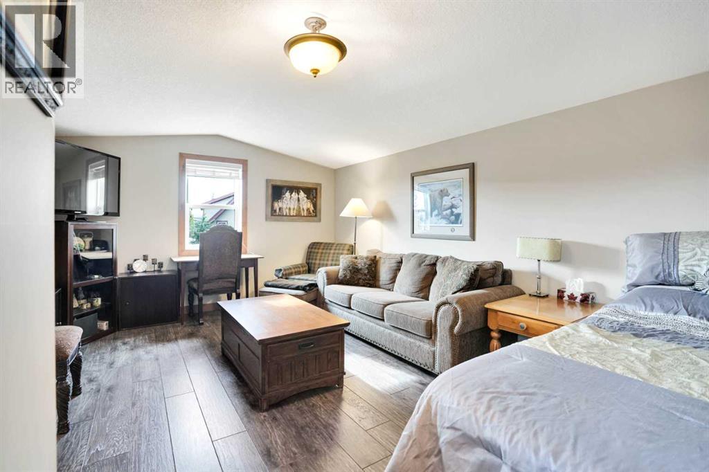 210 Cottageclub Crescent, Rural Rocky View County, Alberta  T4C 1B1 - Photo 28 - A2291756