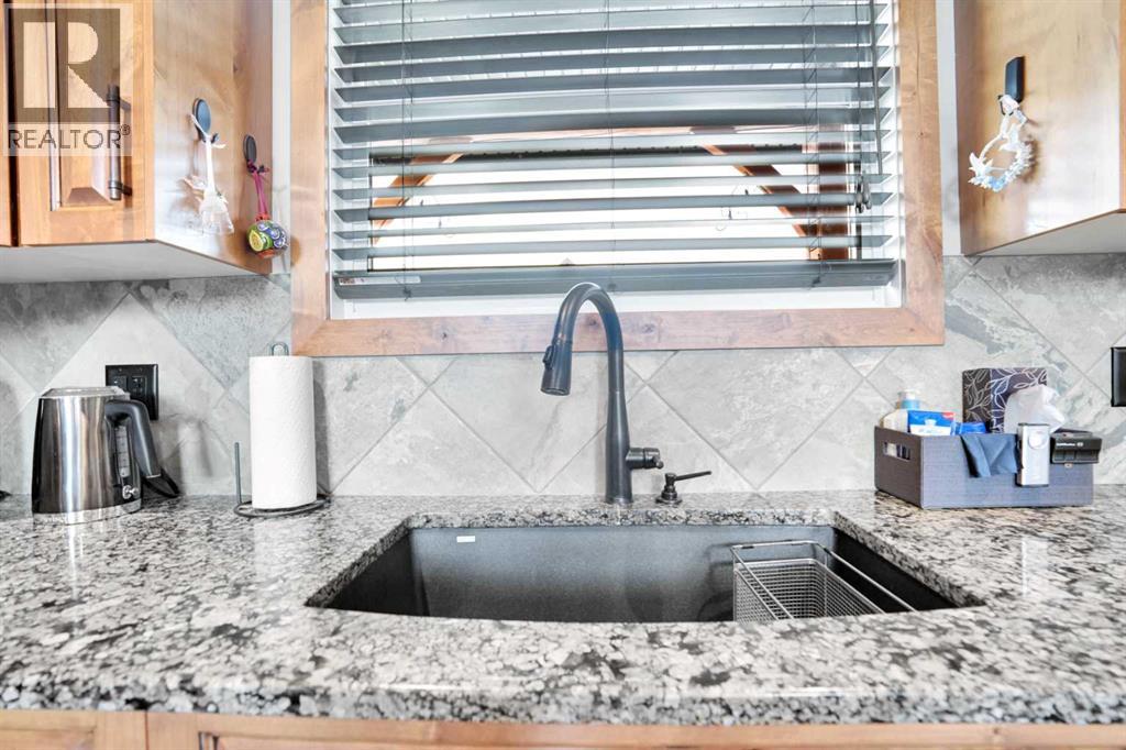 210 Cottageclub Crescent, Rural Rocky View County, Alberta  T4C 1B1 - Photo 10 - A2291756