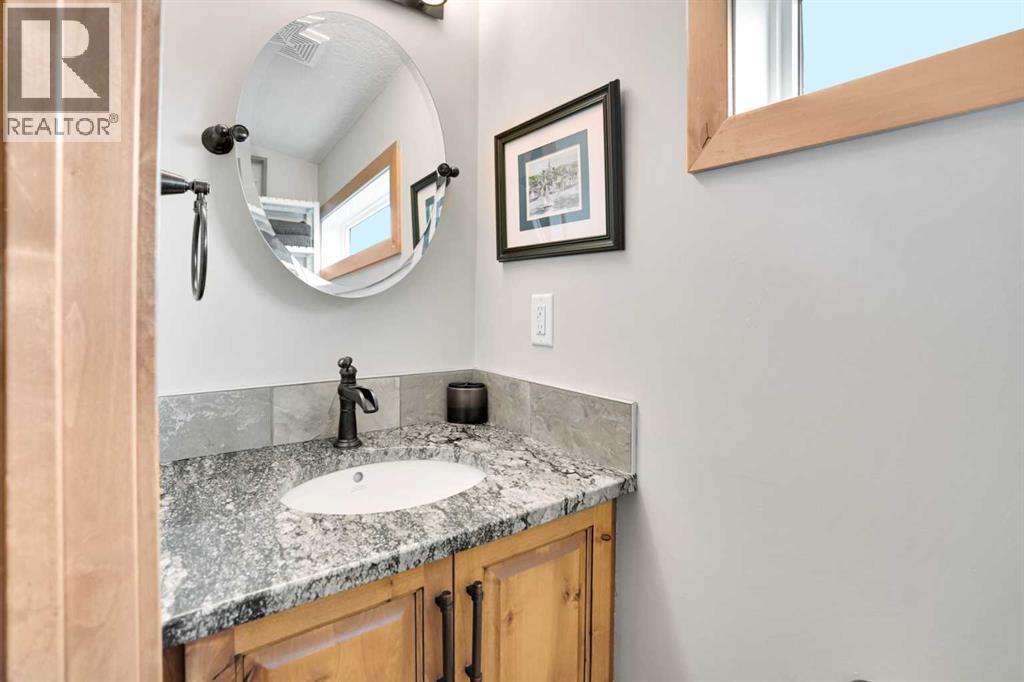 210 Cottageclub Crescent, Rural Rocky View County, Alberta  T4C 1B1 - Photo 30 - A2291756