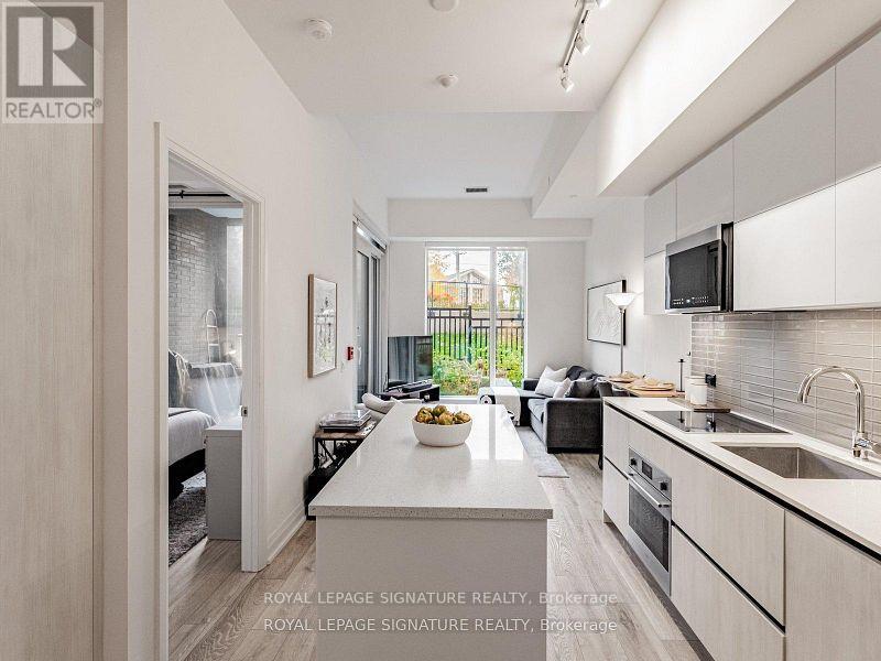 102 - 21 Park Street E, Mississauga, Ontario  L5G 0C2 - Photo 1 - W12752260