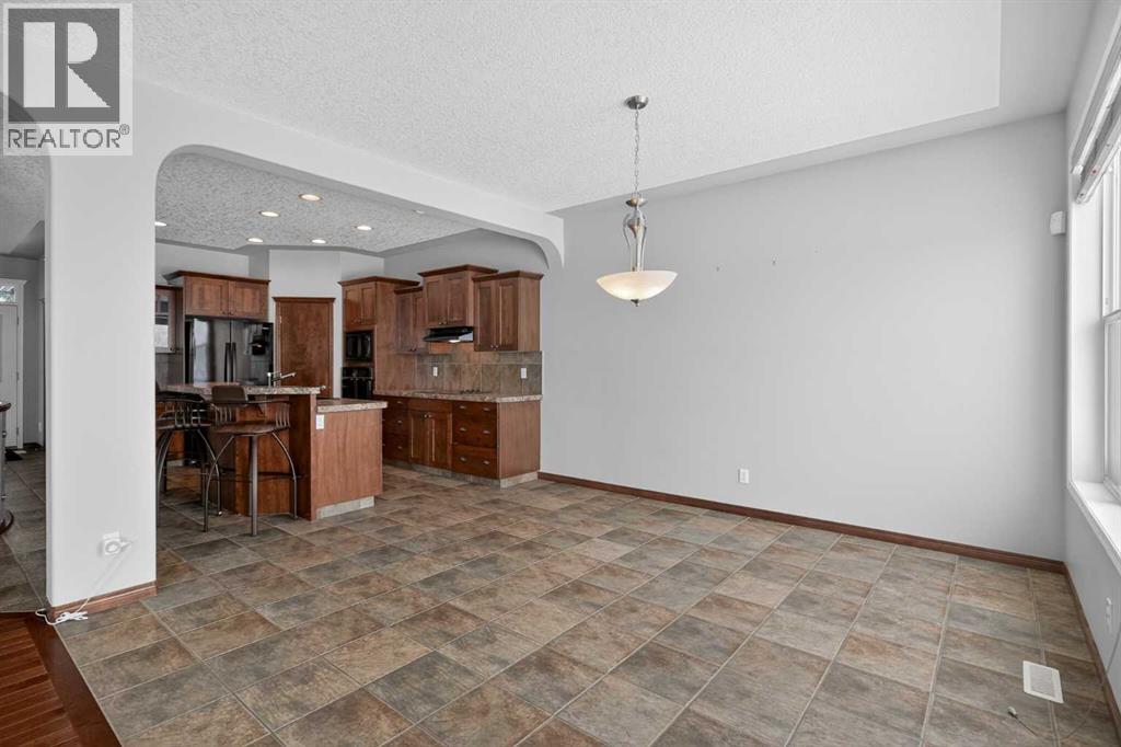 70 Panatella Circle NW, Calgary, Alberta  T3K 5Z7 - Photo 6 - A2301330