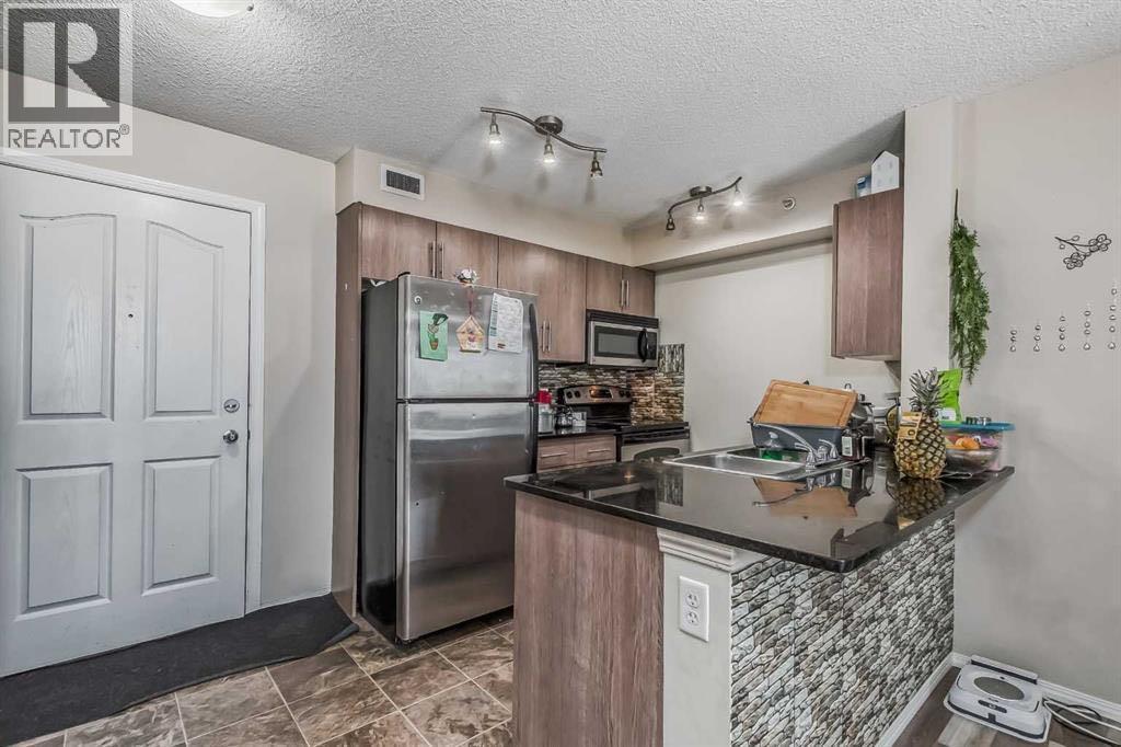408, 7110 80 Avenue Ne, Calgary, Alberta  T3J 0N4 - Photo 2 - A2301920