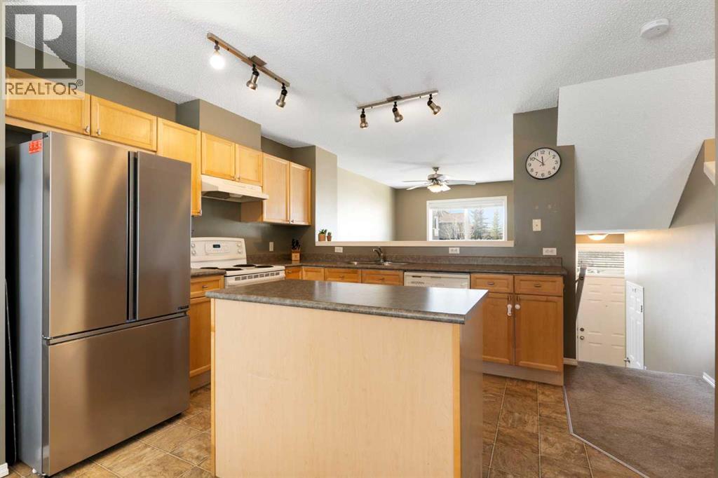 18 Tuscany Court NW, Calgary, Alberta  T3L 2Y8 - Photo 7 - A2294917