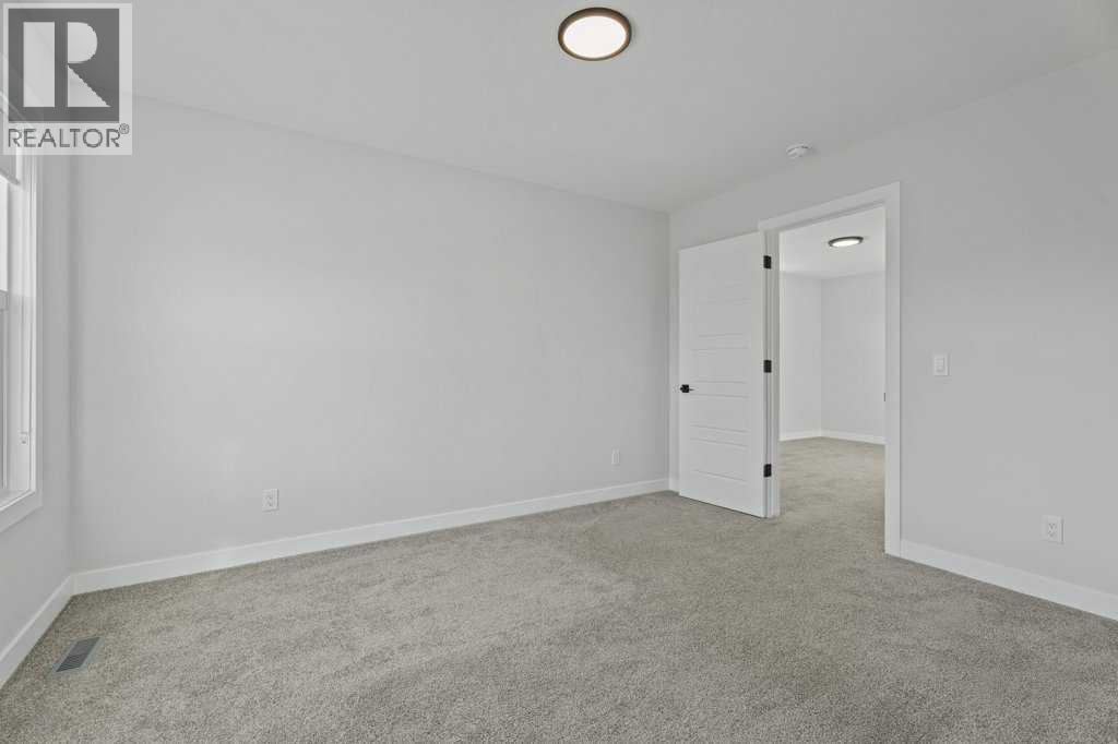 71 Ranchers View, Okotoks, Alberta  T1S 5R6 - Photo 40 - A2285159