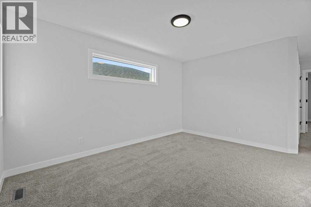 71 Ranchers View, Okotoks, Alberta  T1S 5R6 - Photo 34 - A2285159