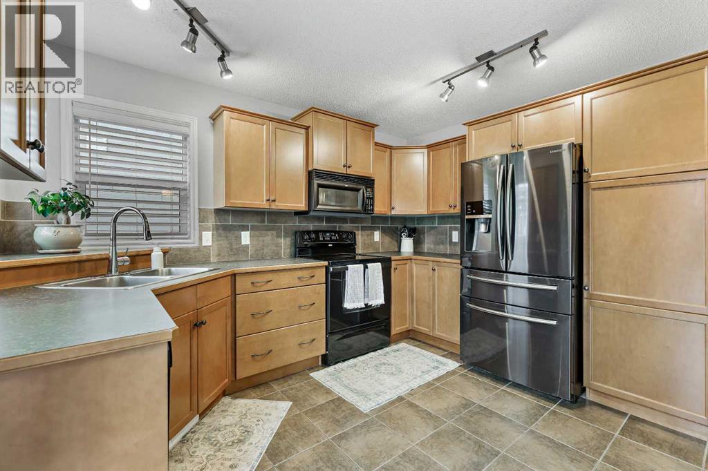 25 Mckinnon Street NW, Langdon, Alberta  T0J 1X2 - Photo 12 - A2270671