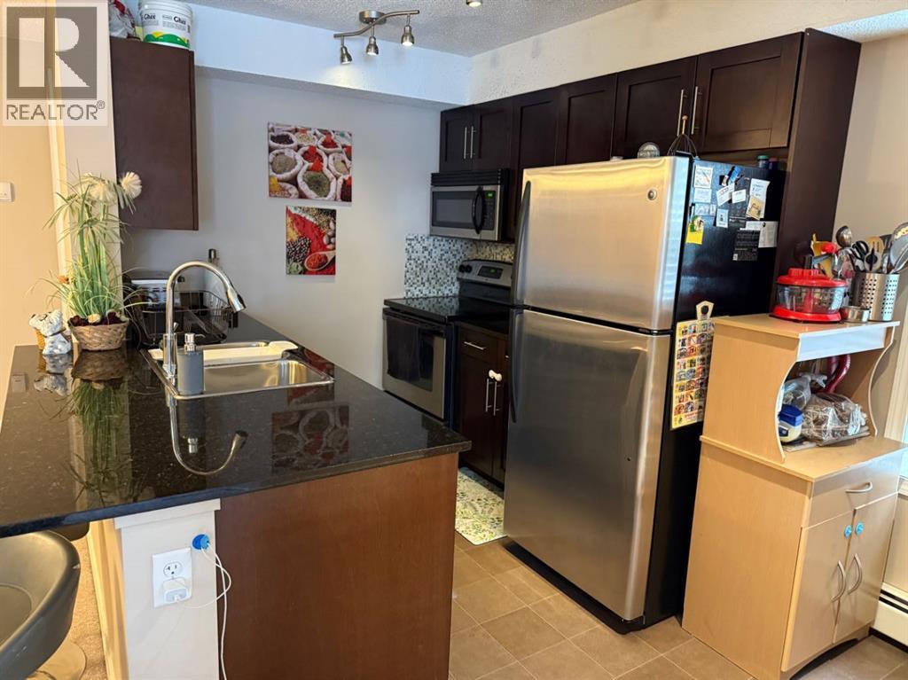 202, 7210 80 Avenue Ne, Calgary, Alberta  T3J 0N7 - Photo 5 - A2304158