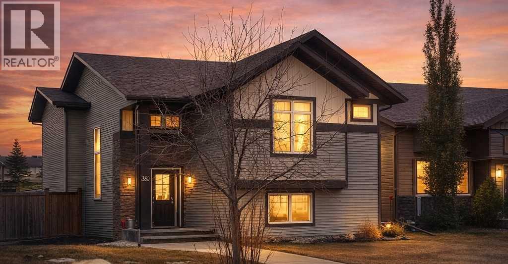 Gorgeous fully finished bi-level featuring coffered 9’ ceilings throughout the main floor and a bright, open-concept design. This 4 bedroom, 3 bathroom home offers a warm and inviting living space complete with a gas fireplace accented by stone surround, built-in shelving, and gleaming laminate flooring.  The spacious entry welcomes you with a generous closet, leading upstairs to a well-appointed kitchen showcasing stainless steel appliances, quality cabinetry, and a functional breakfast bar. The open layout seamlessly connects the kitchen, dining, and living areas, with garden door access to a large south-facing deck—perfect for summer BBQs and effortless entertaining.  The primary bedroom easily accommodates a king-sized suite and features a walk-in closet and private 3-piece ensuite. A second bedroom and a full 4-piece bathroom complete the main level.  Downstairs, you’ll be impressed by the massive 21’ x 18’ family room, highlighted by a stunning coffered, lighted ceiling and several built in speakers. The lower level also includes two additional bedrooms (one with a large walk-in closet), a 4-piece bathroom, and a laundry room with in-floor heat and large windows that bring in plenty of natural light.  Step outside to enjoy the fully fenced yard and BRAND NEW 20’ x 24’ garage. All of this is perfectly complemented by peaceful country views right across the street. Solar panels provide an added benefit, enhancing energy efficiency and long-term savings. (id:48254)