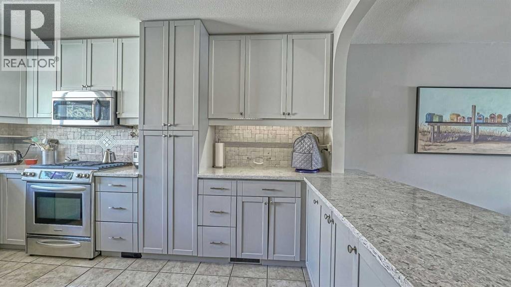 64 Midglen Drive Se, Calgary, Alberta  T2X 1G7 - Photo 9 - A2302754