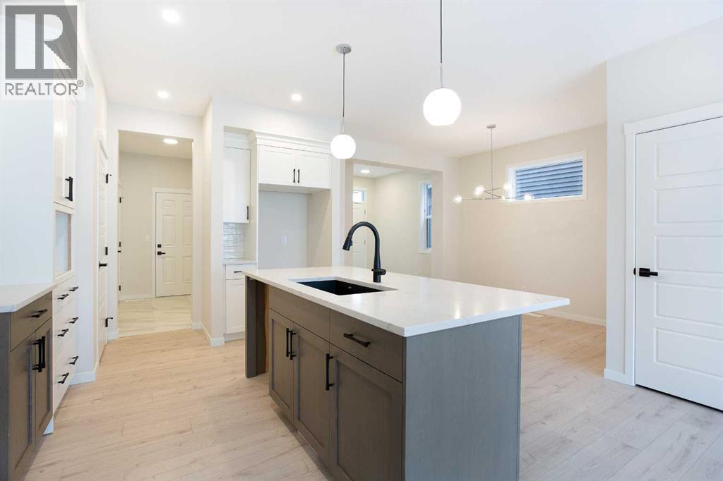 53 Creekside Passage SW, Calgary, Alberta  T2X 5V6 - Photo 9 - A2279223