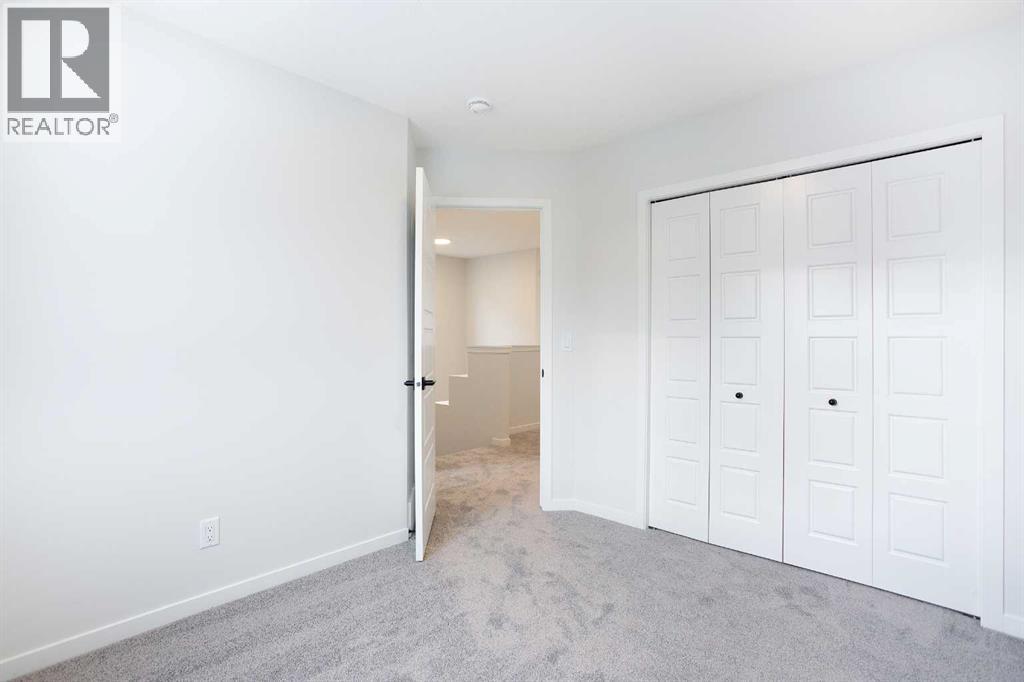 49 Creekside Passage SW, Calgary, Alberta  T2X 5V6 - Photo 19 - A2279243