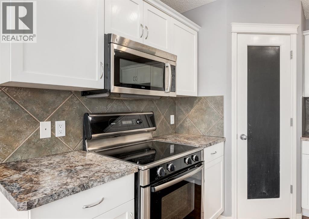 113 Luxstone Green SW, Airdrie, Alberta  T4B 3B9 - Photo 7 - A2294849