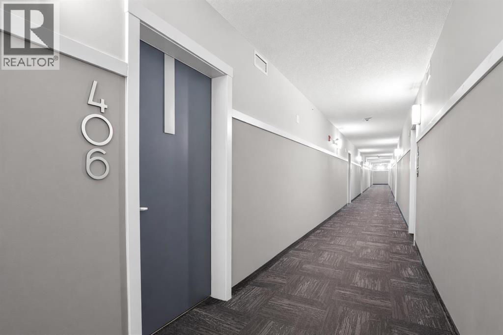 406, 370 Harvest Hills Common NE, Calgary, Alberta  T3K 2M8 - Photo 5 - A2285239