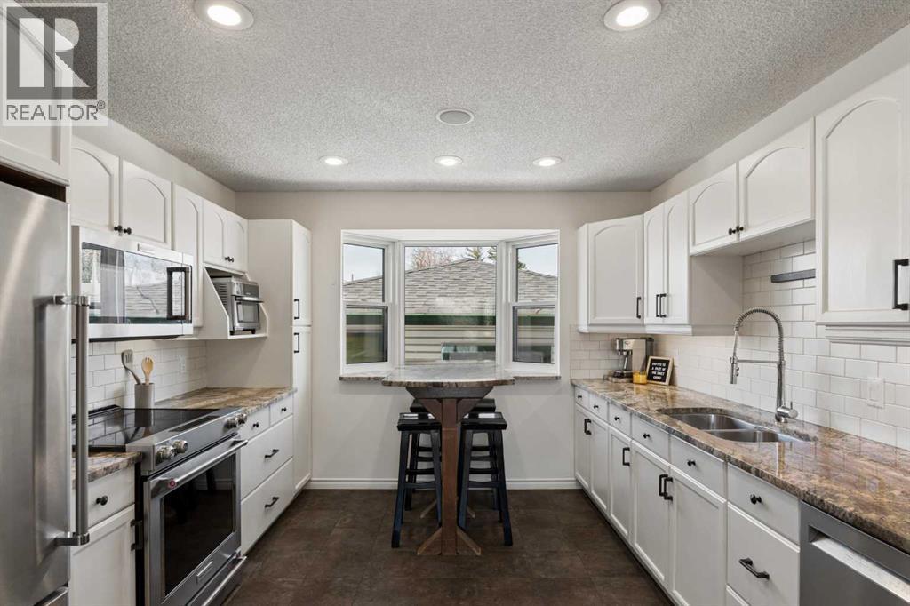 8011 Huntington Street NE, Calgary, Alberta  T2K 5B8 - Photo 11 - A2303394