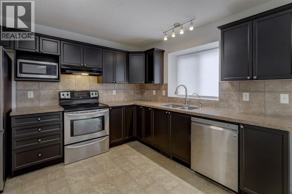 233 Luxstone Road Sw, Airdrie, Alberta  T4B 0K5 - Photo 3 - A2296582