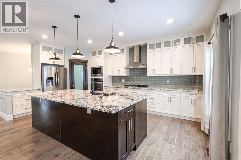 148 Baysprings Court SW, Airdrie, Alberta  T4B 3X7 - Photo 4 - A2299469