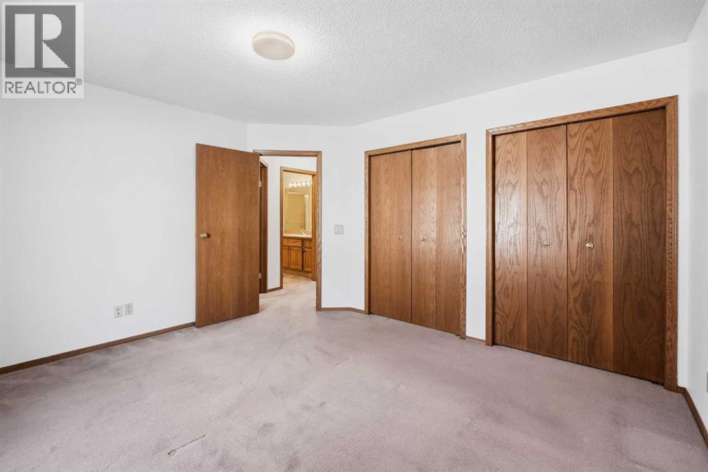 12 Arbour Cliff Close NW, Calgary, Alberta  T3G 3W8 - Photo 19 - A2276284