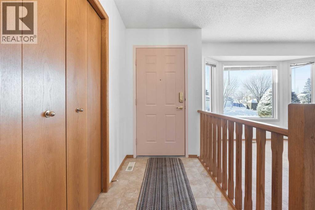 12 Arbour Cliff Close NW, Calgary, Alberta  T3G 3W8 - Photo 3 - A2276284