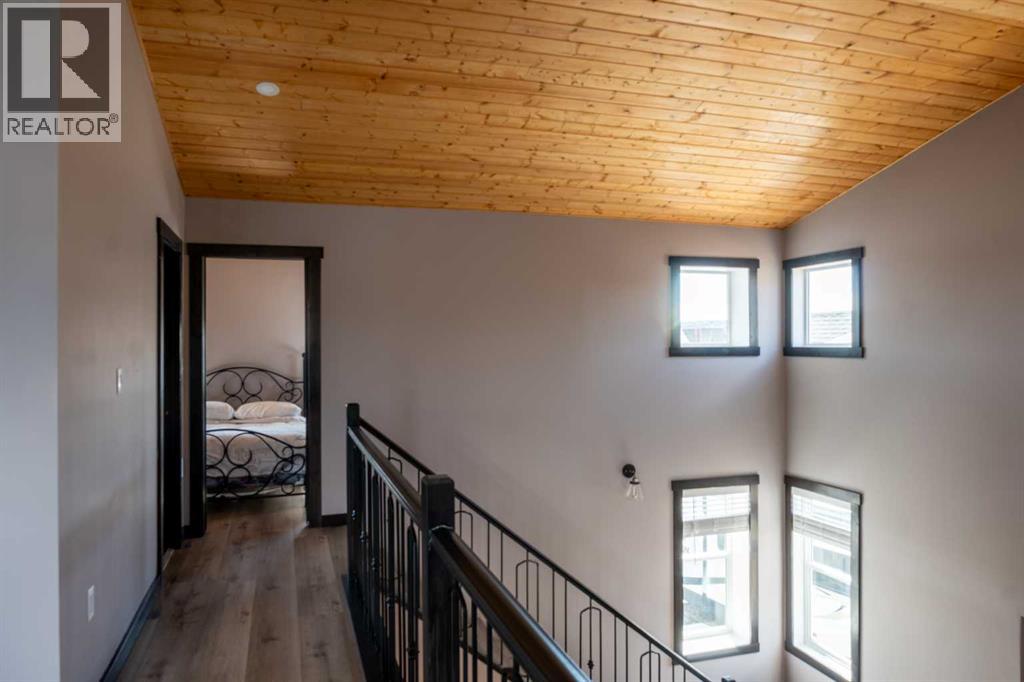 216 Cottageclub Crescent, Rural Rocky View County, Alberta  T4C 1B1 - Photo 11 - A2302814