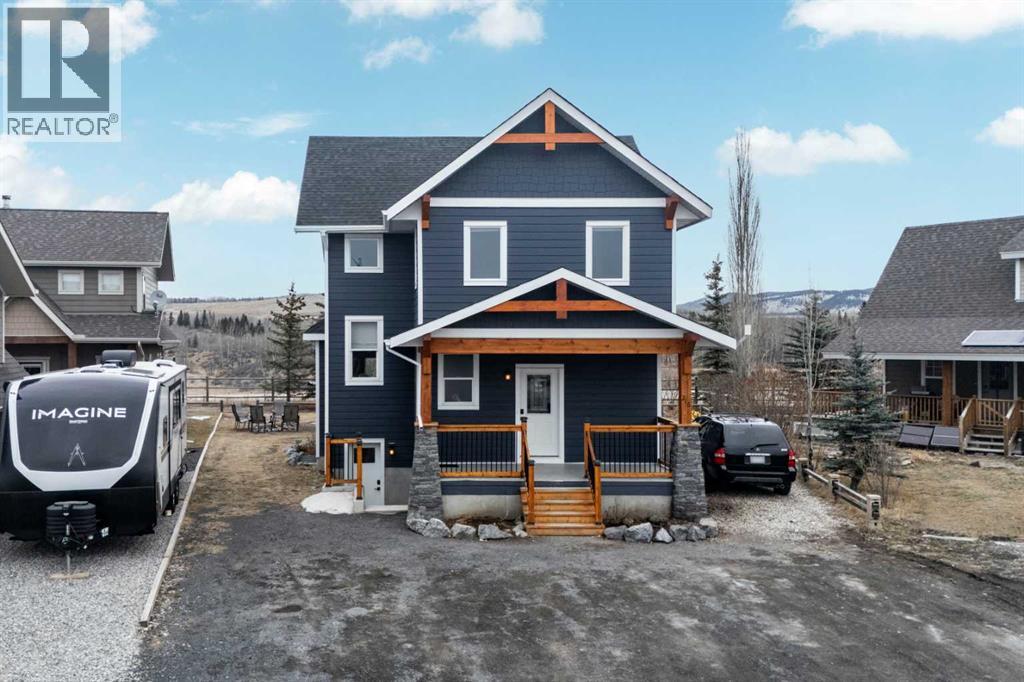 216 Cottageclub Crescent, Rural Rocky View County, Alberta  T4C 1B1 - Photo 2 - A2302814