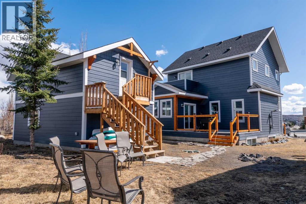 216 Cottageclub Crescent, Rural Rocky View County, Alberta  T4C 1B1 - Photo 4 - A2302814