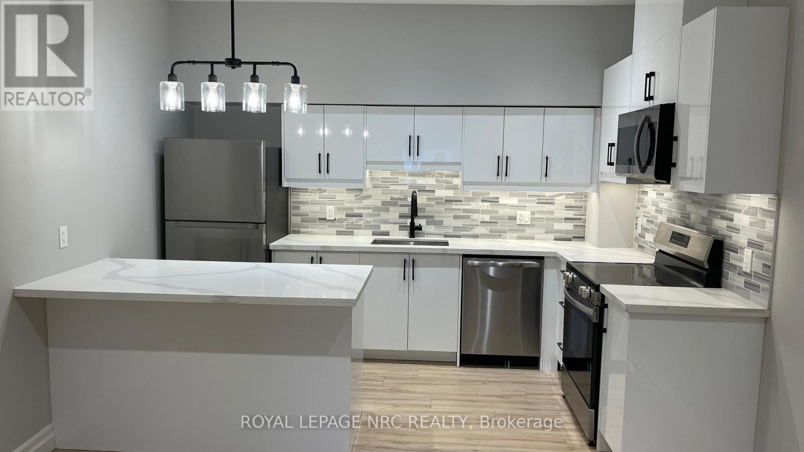 104 - 69 East Main Street, Welland, Ontario  L3B 3W4 - Photo 3 - X13043212