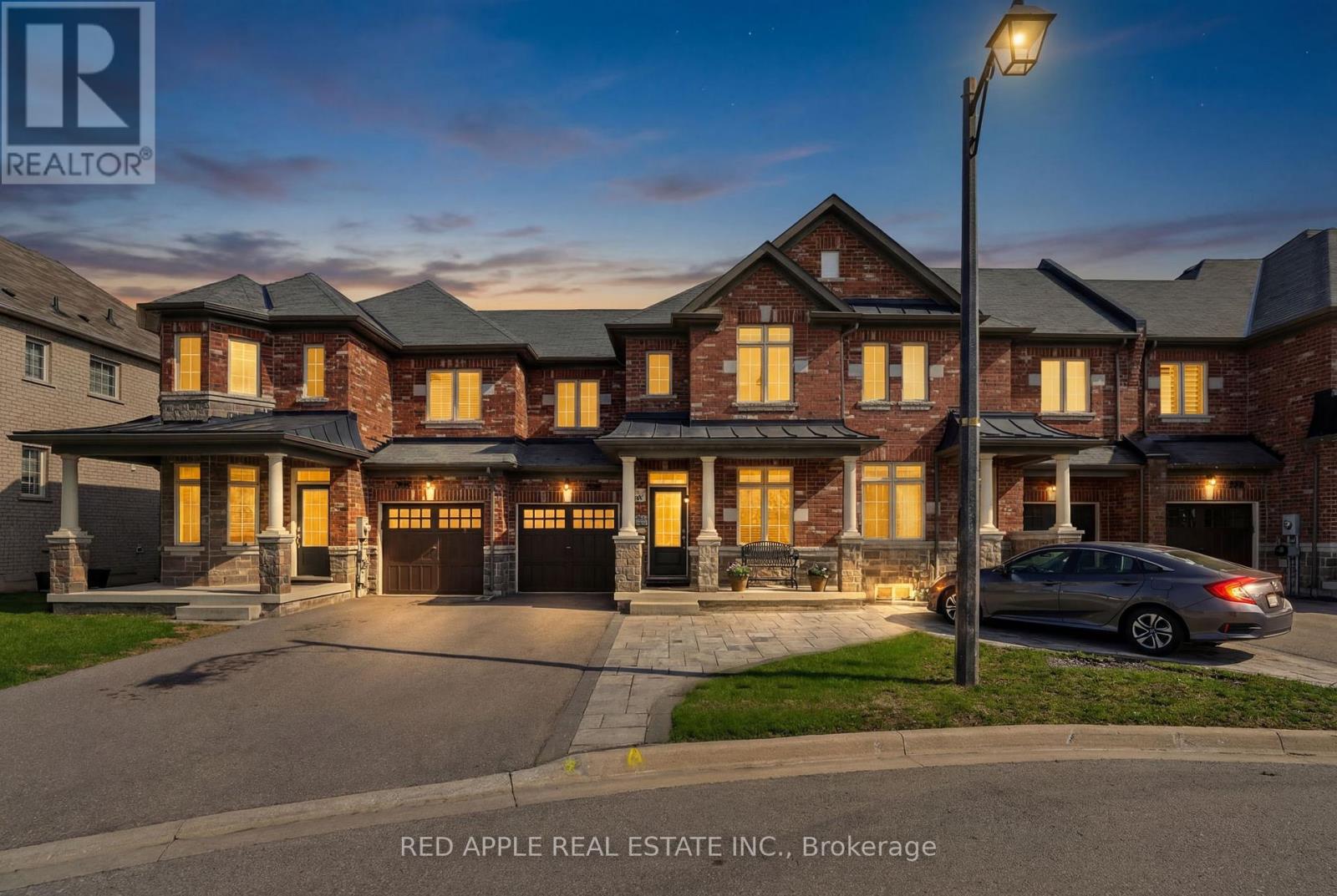 Welcome to this beautifully maintained 3-bedroom, 2.5-bathroom townhouse nestled on a quiet court in the highly sought-after Woodland Hills community of Newmarket. Perfectly suited for families, professionals, and commuters alike, this exceptional home offers comfort, style, and an unbeatable location. Step inside to discover a meticulously cared-for interior featuring hardwood, ceramic, and luxury laminate flooring throughout. The inviting living room is the perfect place to relax or entertain, complete with a cozy gas fireplace and convenient TV connections above the mantel. Overlooking the living area and bright breakfast nook, the well-appointed kitchen boasts stainless steel appliances, a stylish glass backsplash, and a functional layout ideal for everyday living. Upstairs, you'll find three spacious bedrooms, including a generous primary retreat, along with two bathrooms and a convenient main-floor powder room. The fully finished basement adds valuable living space, offering a warm and welcoming rec room-perfect for movie nights, a play area, or a home office. Enjoy outdoor living in the fenced, south-facing backyard, ideal for soaking up the sun, gardening, or hosting friends. The newer interlock front entrance provides additional parking, while the built-in garage offers convenient access to both the home and backyard.  Located just steps from the scenic Clifford Perry Place Boardwalk and a brand-new playground currently under construction, this home is perfectly positioned for young families. With easy access to Bathurst Street, commuting is effortless while still enjoying the peace and tranquility of this family-friendly neighbourhood. A wonderful opportunity to own a move-in ready home in one of Newmarket's most desirable communities. (id:48254)