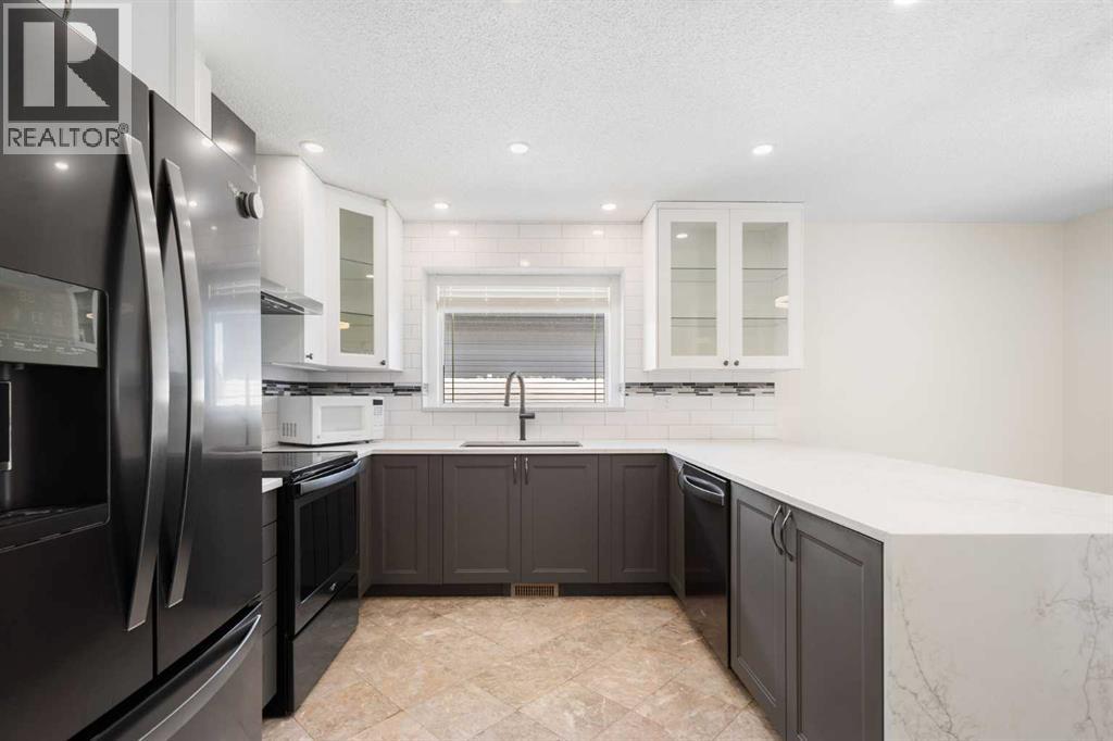 108   Woodmont Drive SW, Calgary, Alberta  T2W 4M3 - Photo 11 - A2303386