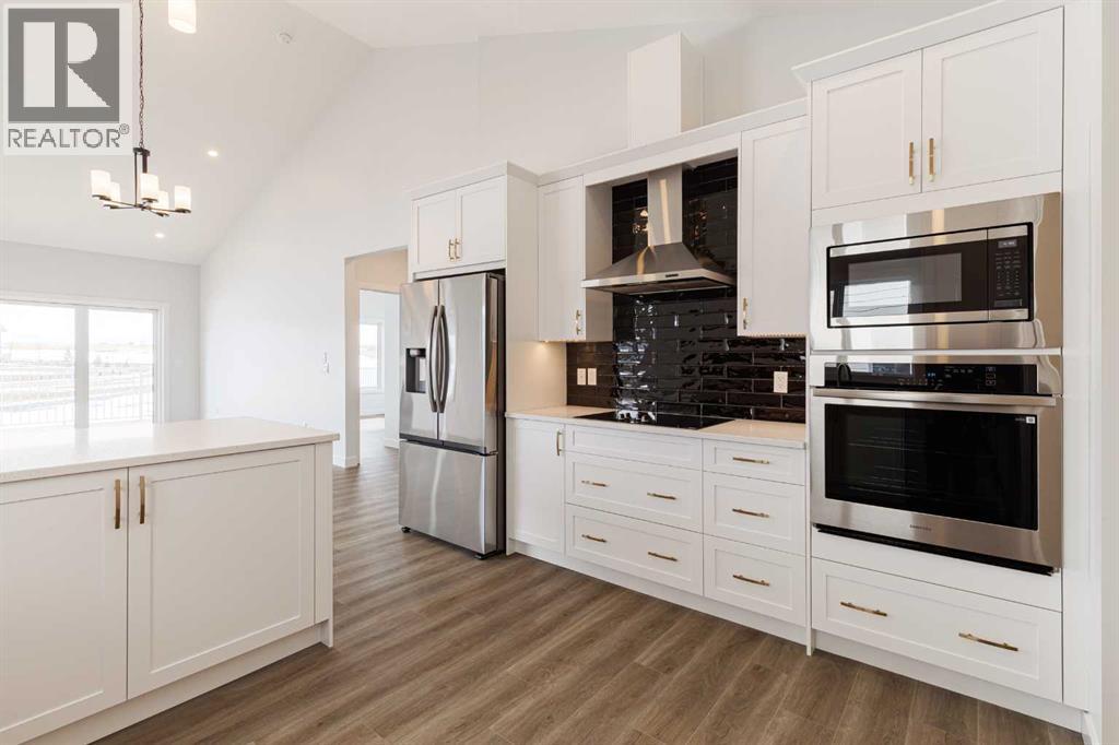 125 Monarch Bend, Rural Rocky View County, Alberta  T3Z 0K4 - Photo 5 - A2302248