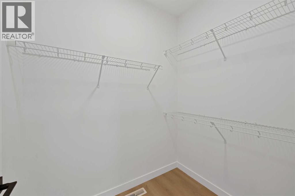 82 Heritage Circle, Cochrane, Alberta  T4C 3G9 - Photo 5 - A2304448