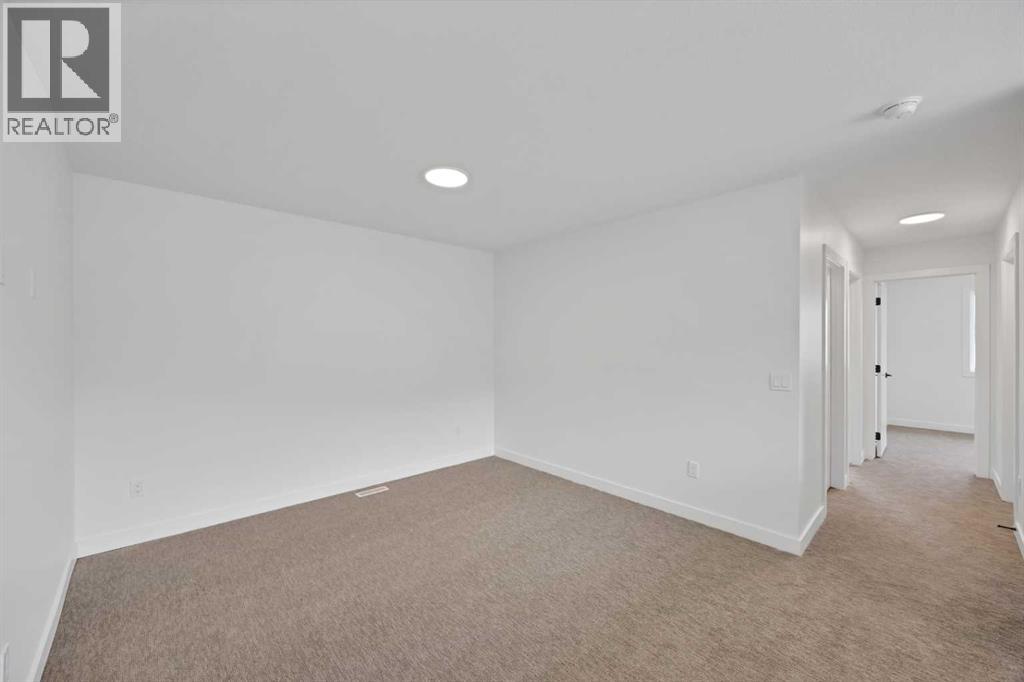 82 Heritage Circle, Cochrane, Alberta  T4C 3G9 - Photo 17 - A2304448